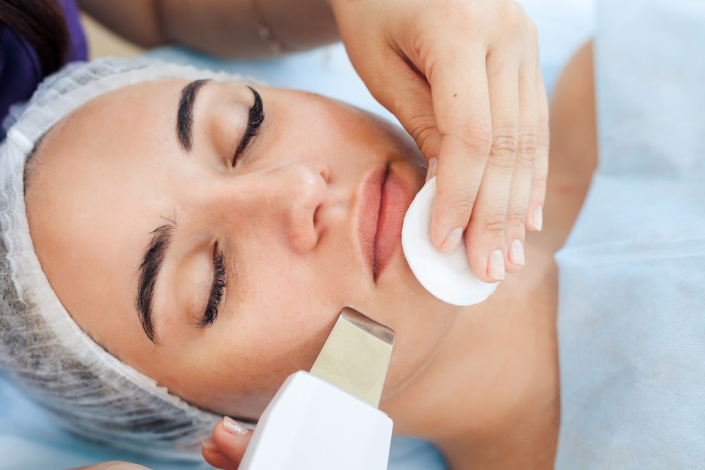 Face skin care. Woman getting facial ultrasound cleaning - Savvy Tokyo